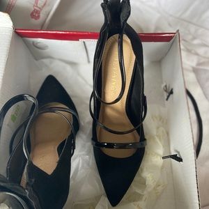 Black heels with glossy straps